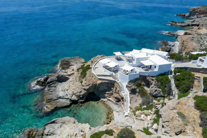 Aerial view of Aegean Sea coastline with whitewashed coastal terrace